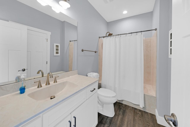 full bathroom featuring shower / bath combination with curtain, wood-type flooring, toilet, and vanity