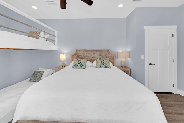 bedroom featuring ceiling fan and dark hardwood / wood-style flooring