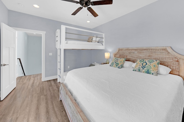 bedroom with light hardwood / wood-style flooring and ceiling fan