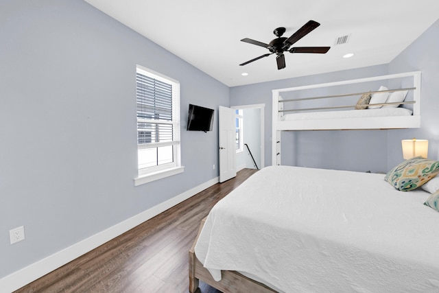 bedroom with dark wood-type flooring and ceiling fan