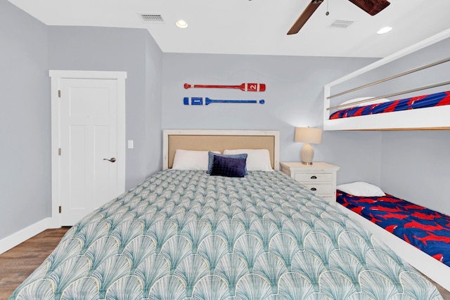 bedroom with dark wood-type flooring and ceiling fan