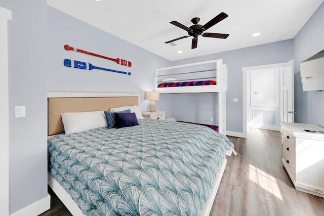 bedroom with wood-type flooring and ceiling fan