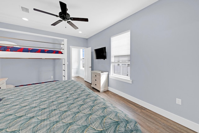 unfurnished bedroom with ceiling fan and light wood-type flooring