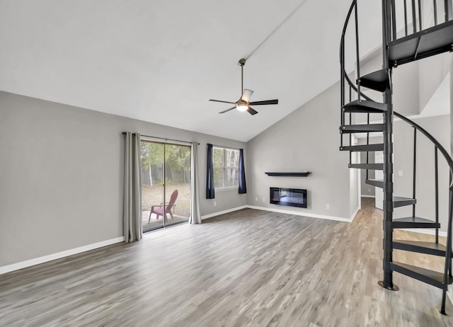 unfurnished living room featuring high vaulted ceiling, hardwood / wood-style floors, and ceiling fan