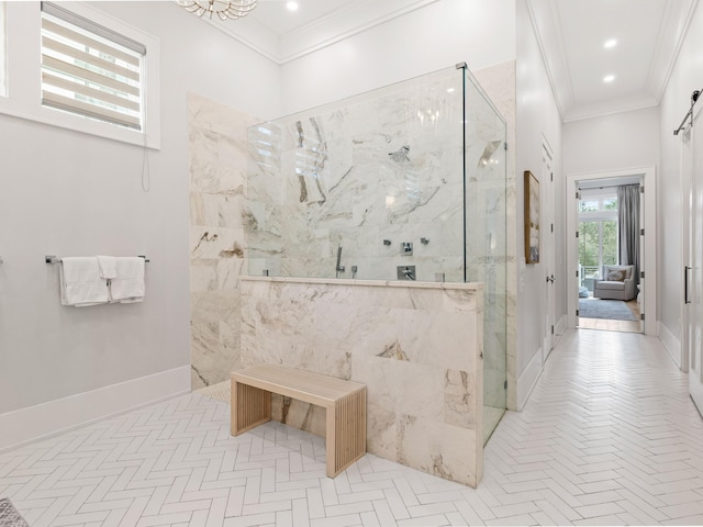 bathroom with ornamental molding and tiled shower