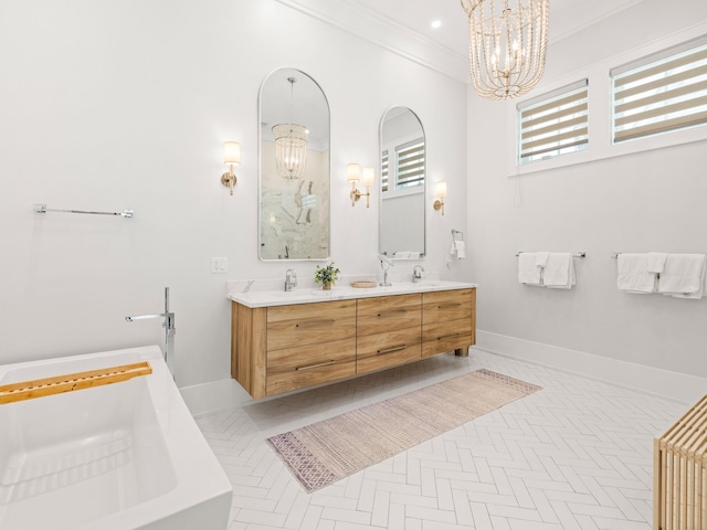 bathroom with parquet floors, vanity, ornamental molding, a bath, and an inviting chandelier