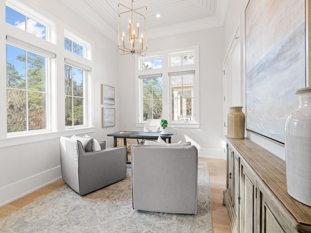 sunroom featuring a chandelier