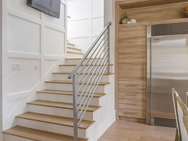 stairway featuring hardwood / wood-style floors