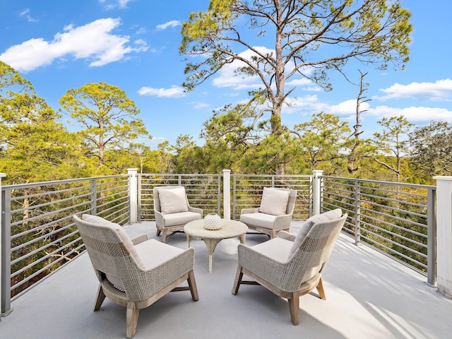 view of patio featuring a balcony