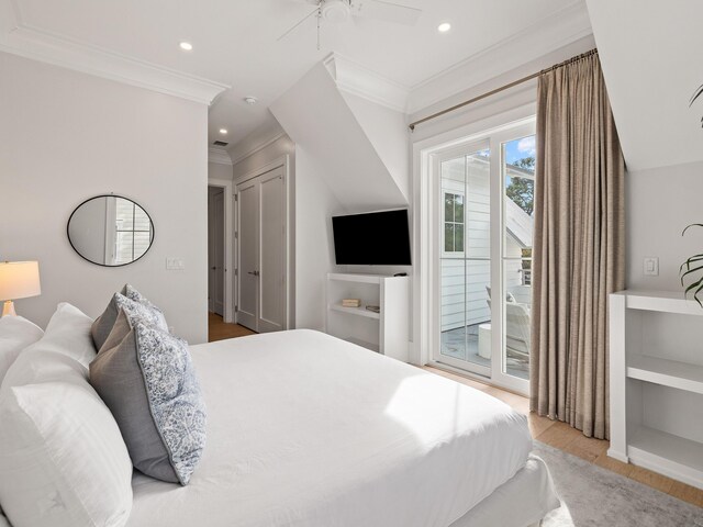 bedroom featuring ceiling fan, ornamental molding, light wood-type flooring, and access to outside