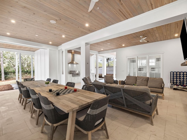 dining space with wood ceiling and ceiling fan