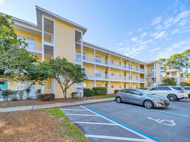 view of property with uncovered parking