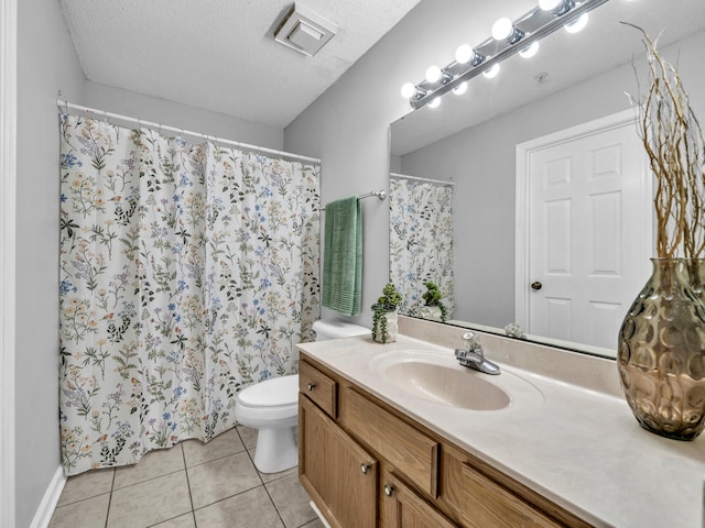 full bath with visible vents, toilet, tile patterned flooring, a textured ceiling, and vanity