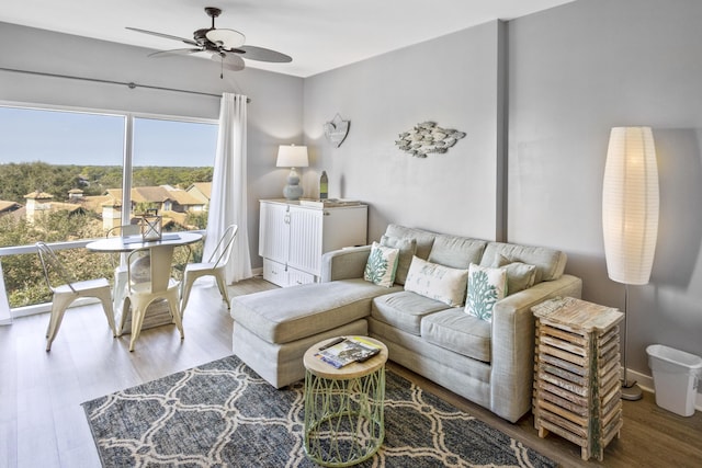 living room featuring hardwood / wood-style flooring and ceiling fan