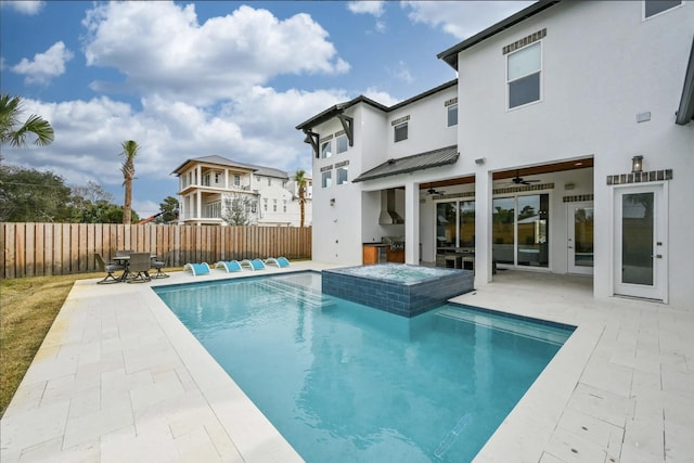 view of swimming pool with a jacuzzi, a patio, and ceiling fan