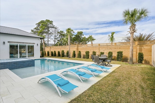 view of pool featuring a lawn and a patio