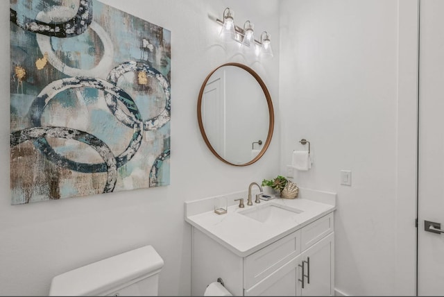 bathroom with vanity and toilet