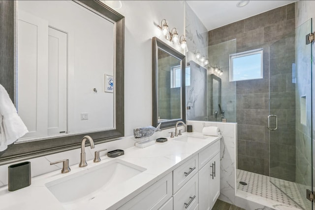 bathroom with walk in shower and vanity