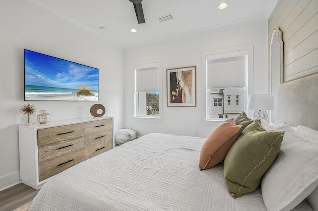 bedroom featuring ceiling fan and light hardwood / wood-style flooring