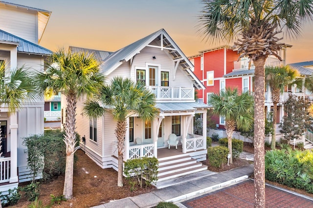 view of front of home featuring a porch and a balcony