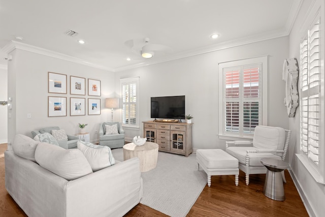 living room featuring wood-type flooring and ornamental molding