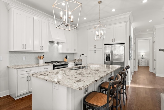 kitchen featuring white cabinetry, an island with sink, appliances with stainless steel finishes, and sink