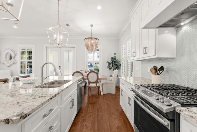 kitchen with appliances with stainless steel finishes, sink, white cabinets, a kitchen island with sink, and custom range hood