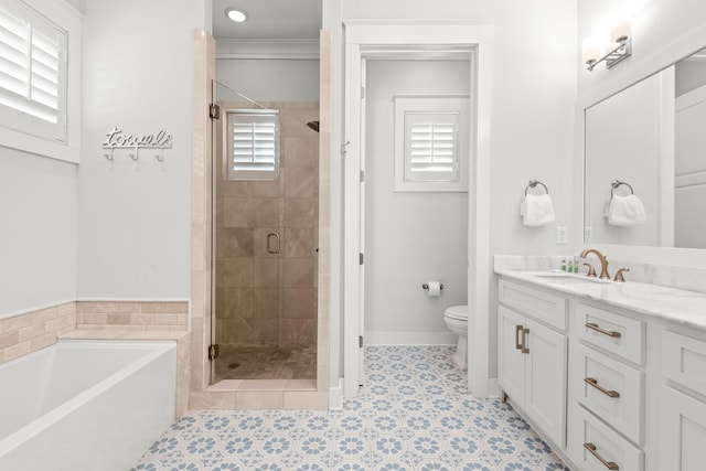 full bathroom featuring vanity, ornamental molding, shower with separate bathtub, and toilet