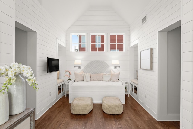 bedroom featuring dark wood-type flooring and vaulted ceiling