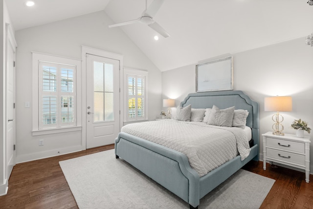 bedroom with multiple windows, vaulted ceiling, ceiling fan, and dark hardwood / wood-style flooring