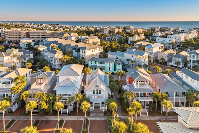 aerial view at dusk with a water view