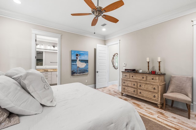 bedroom featuring crown molding, light hardwood / wood-style flooring, ensuite bath, and ceiling fan