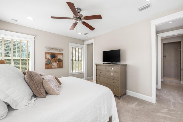 bedroom featuring ceiling fan, light colored carpet, and multiple windows