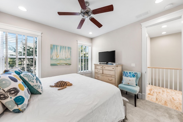 carpeted bedroom with ceiling fan