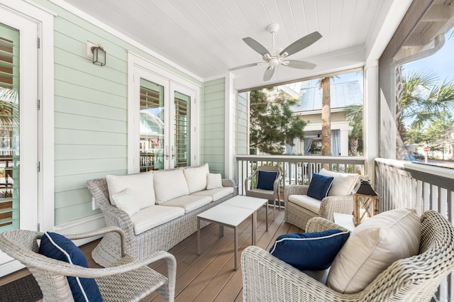 sunroom with wood ceiling and ceiling fan