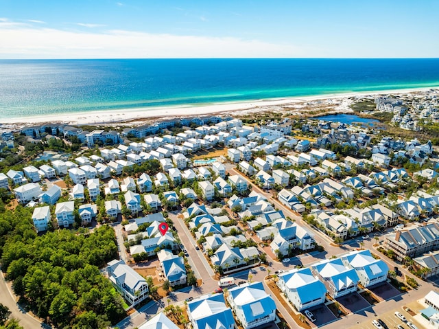 aerial view featuring a water view and a beach view