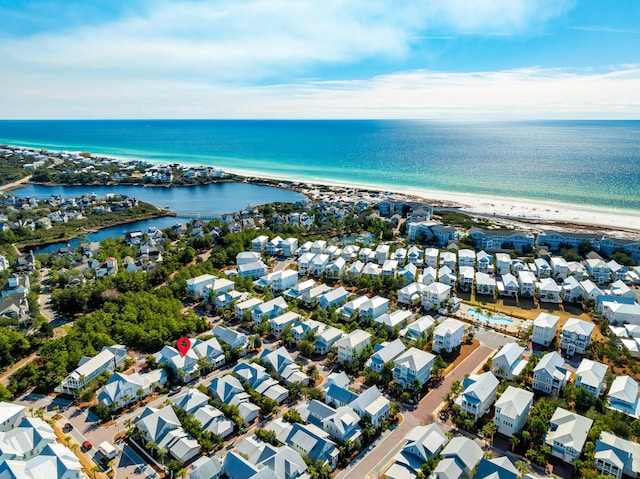 drone / aerial view with a view of the beach and a water view