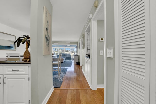 hallway with light wood-type flooring