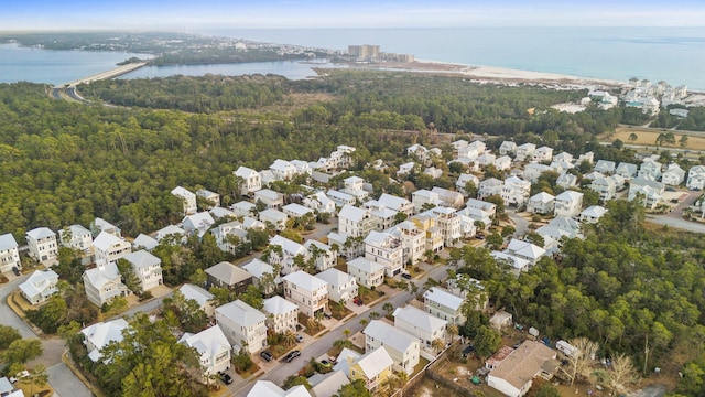 bird's eye view with a water view, a forest view, and a residential view