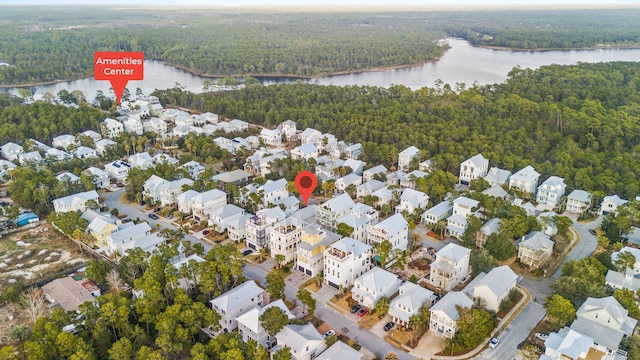 bird's eye view with a residential view, a water view, and a forest view