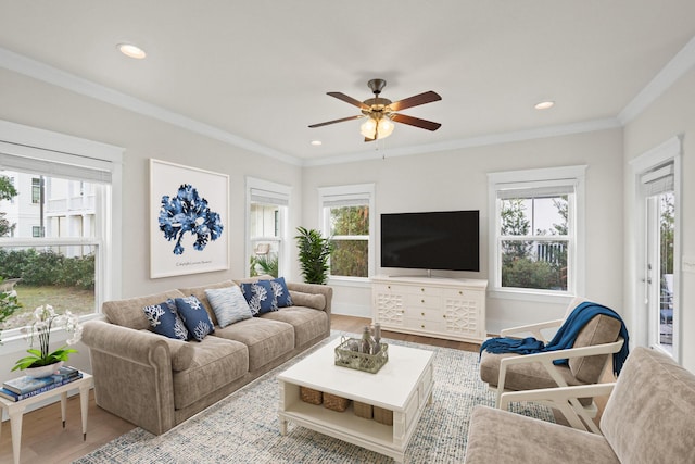 living room with crown molding, recessed lighting, a ceiling fan, wood finished floors, and baseboards