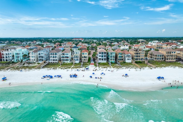 birds eye view of property with a beach view and a water view