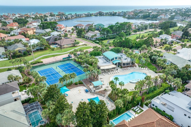 birds eye view of property with a water view