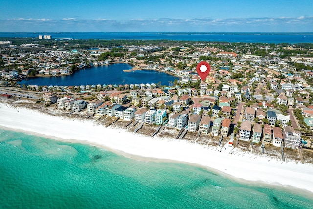 bird's eye view with a water view and a view of the beach