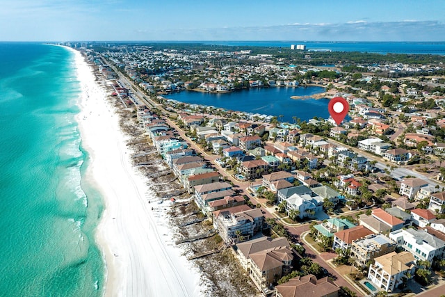 drone / aerial view with a water view and a view of the beach