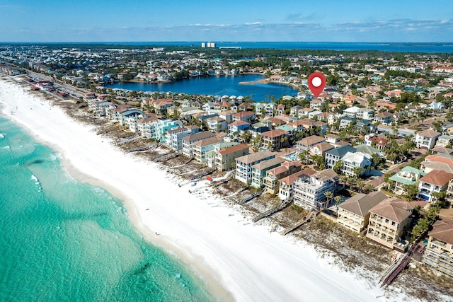 bird's eye view with a water view and a view of the beach