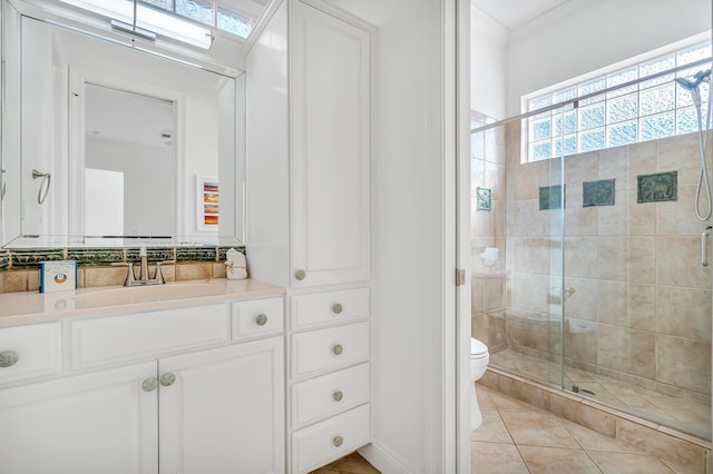 bathroom with an enclosed shower, tile patterned flooring, crown molding, and toilet