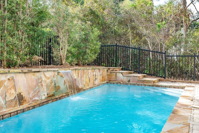 view of pool featuring pool water feature