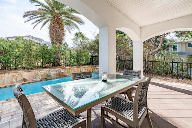 view of patio with pool water feature