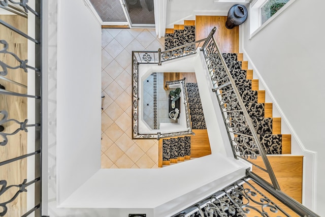 stairs featuring wood-type flooring